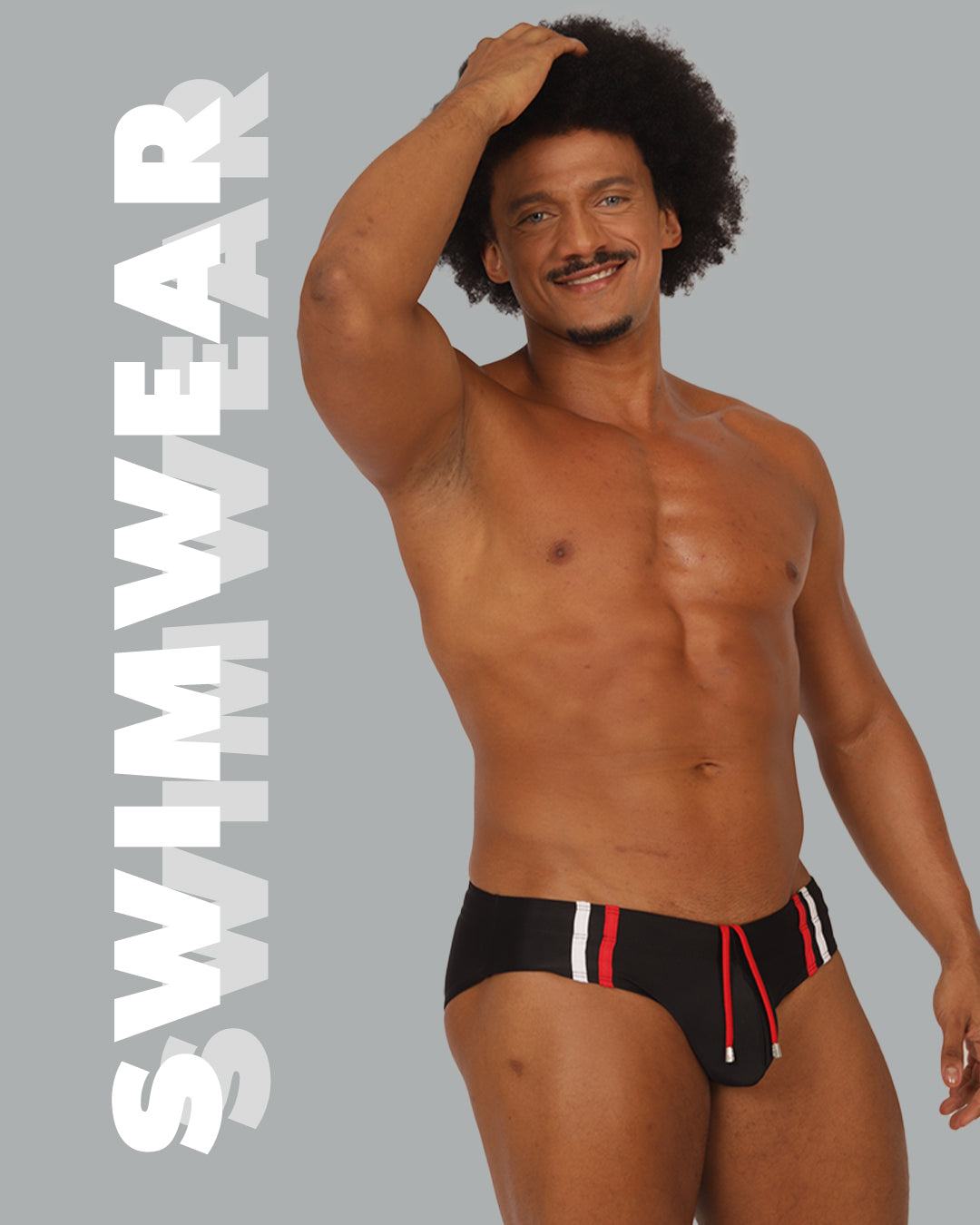 Model wearing Gigo Underwear black swim brief with red and white stripe details