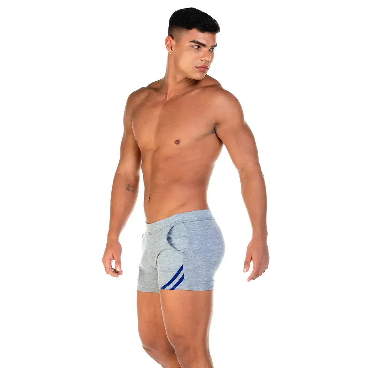 Adult male model wearing gray and blue Gigo men’s shorts, showing side fit, short length, soft fabric texture and movement-friendly sportwear styling.